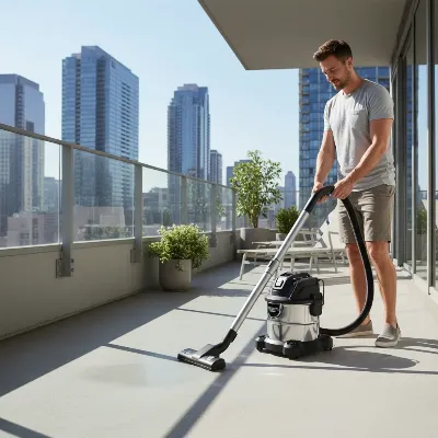 A compact cordless shop vacuum in action on an apartment balcony, easily cleaning up dust and plant debris.